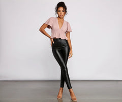 Pleated and Poised Peplum Blouse