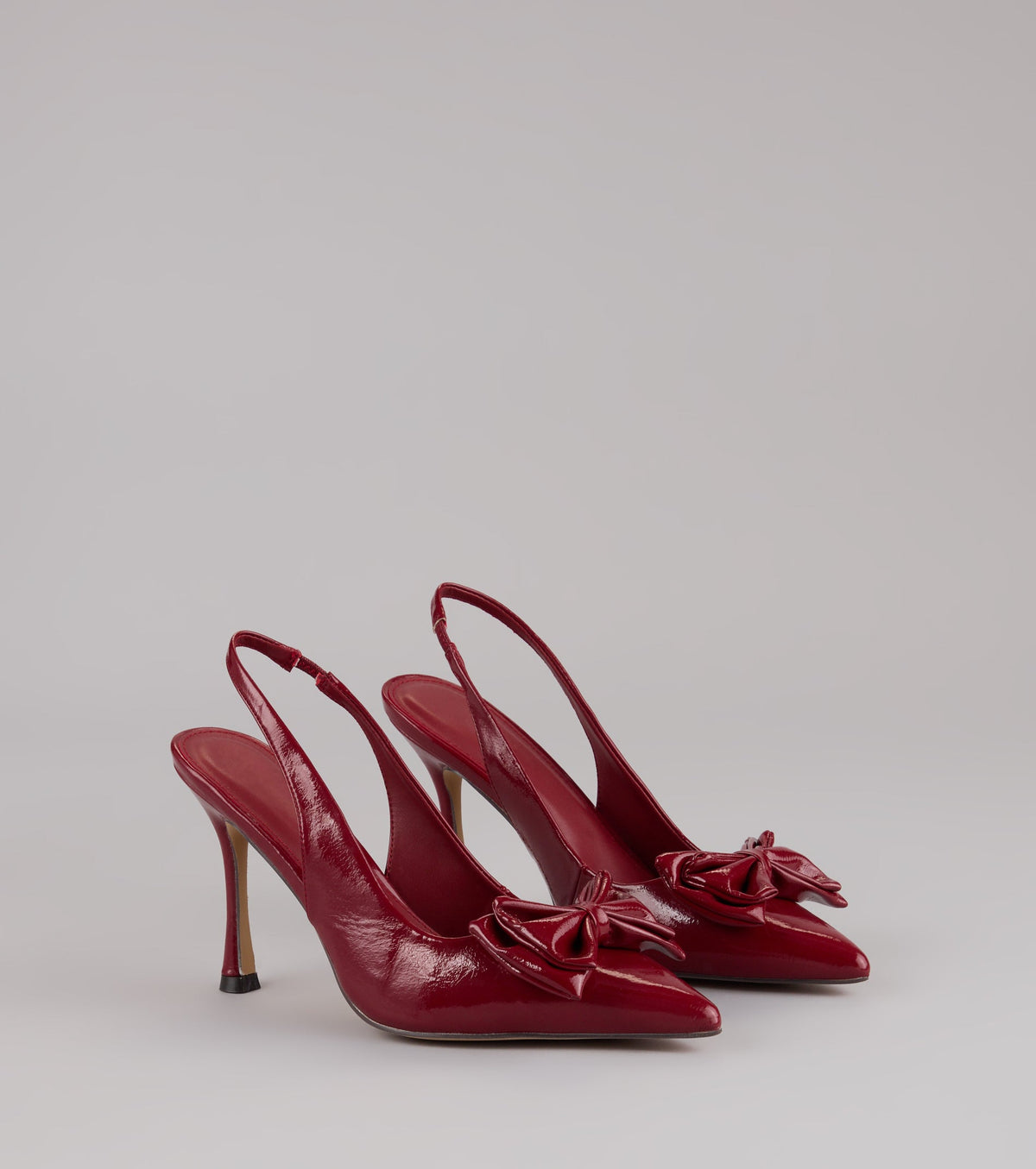 Strut Season Bow Stiletto Pumps